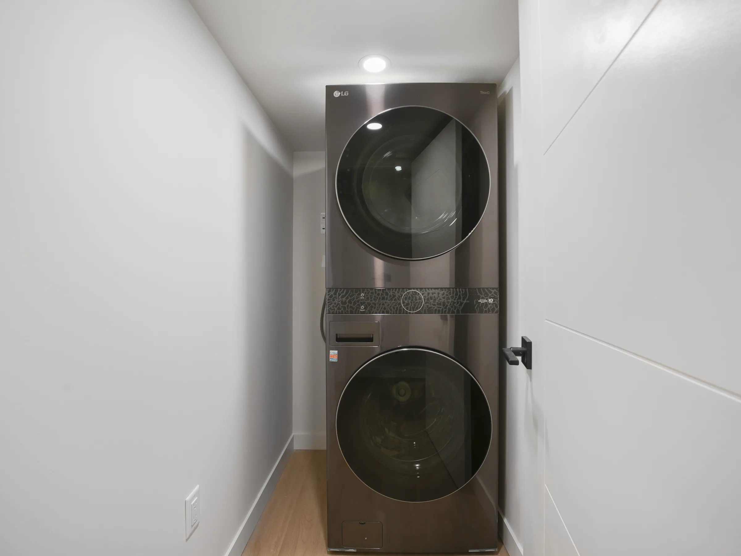 LG stacked washer/dryer, alternate hallway-angle view