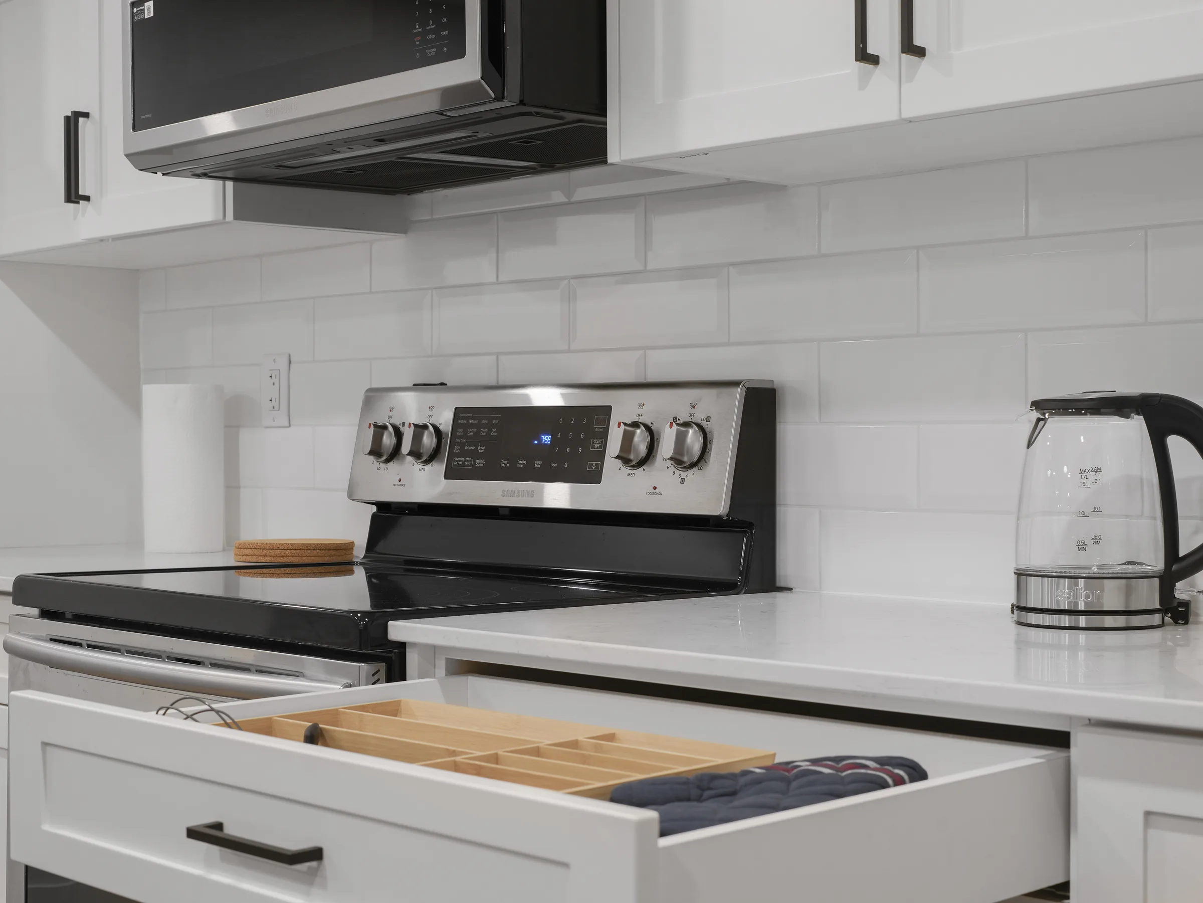 Kitchen stove and drawer close-up with cutlery tray