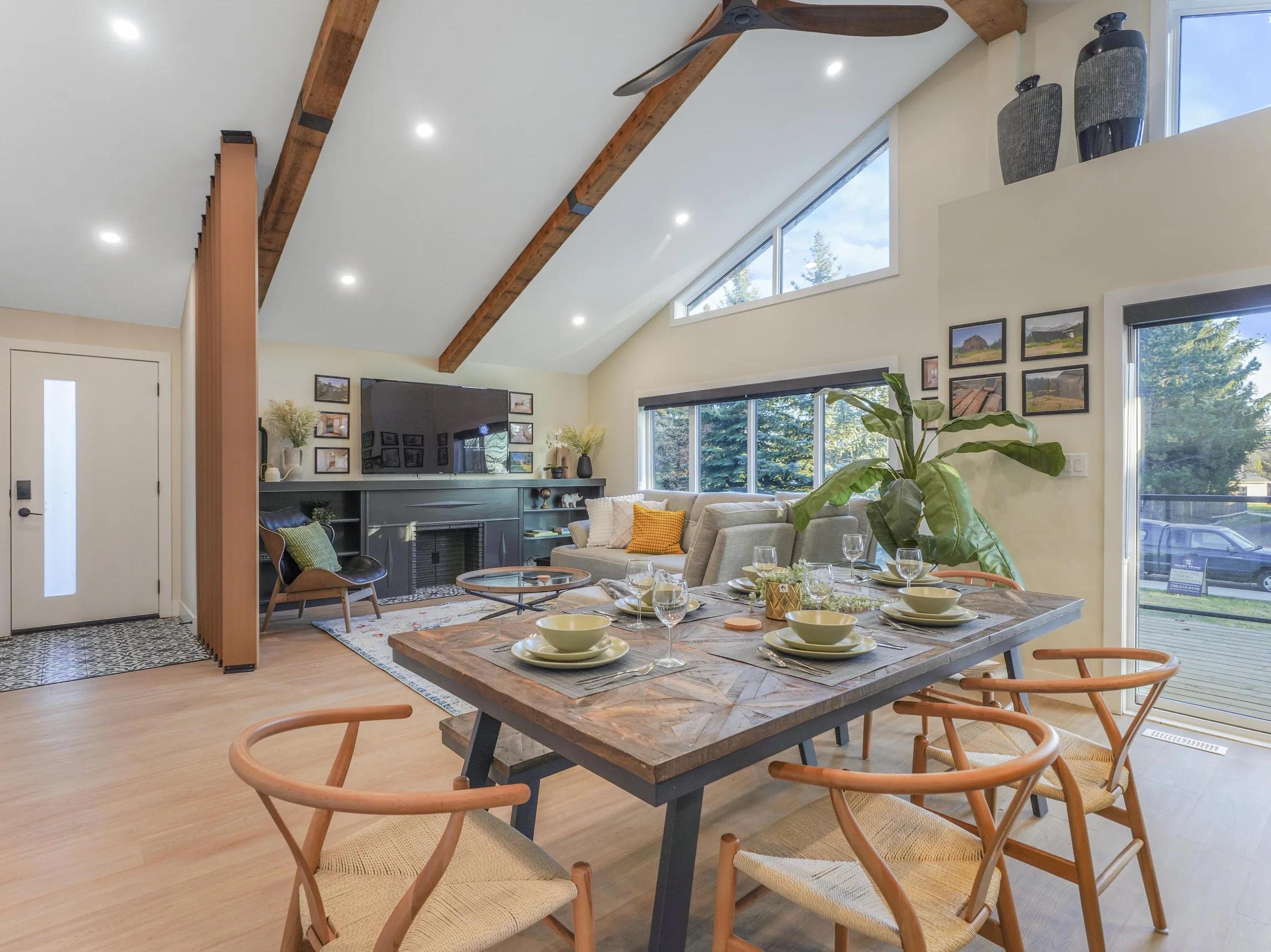 Dining, vaulted ceiling continues, fireplace wall behind