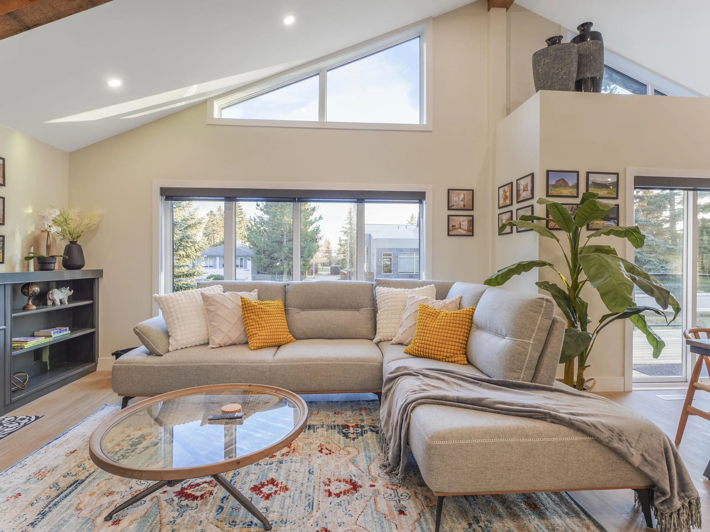 Sectional couch, alternate angle, with tall windows