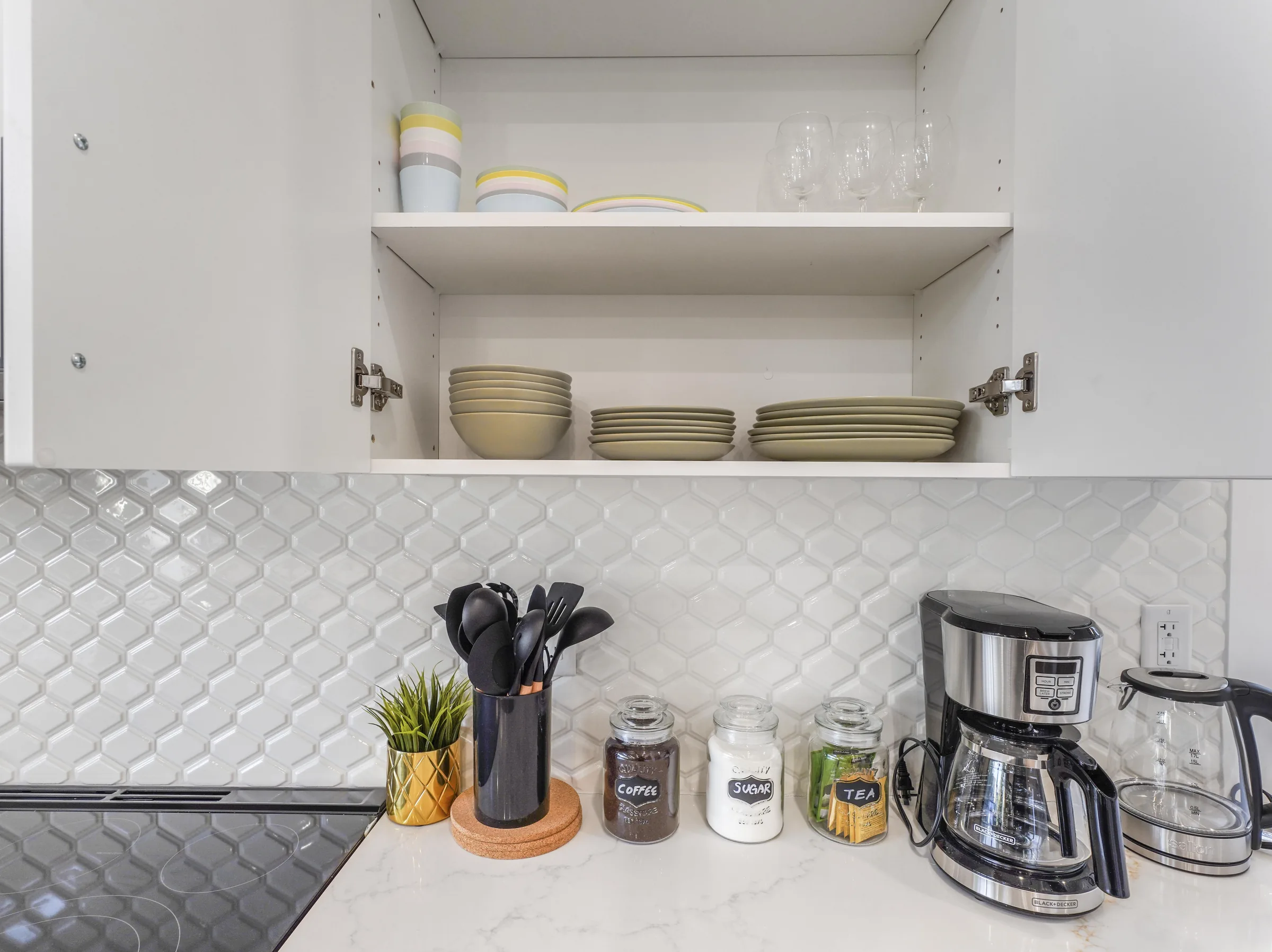 Open cabinet with dishes and glassware