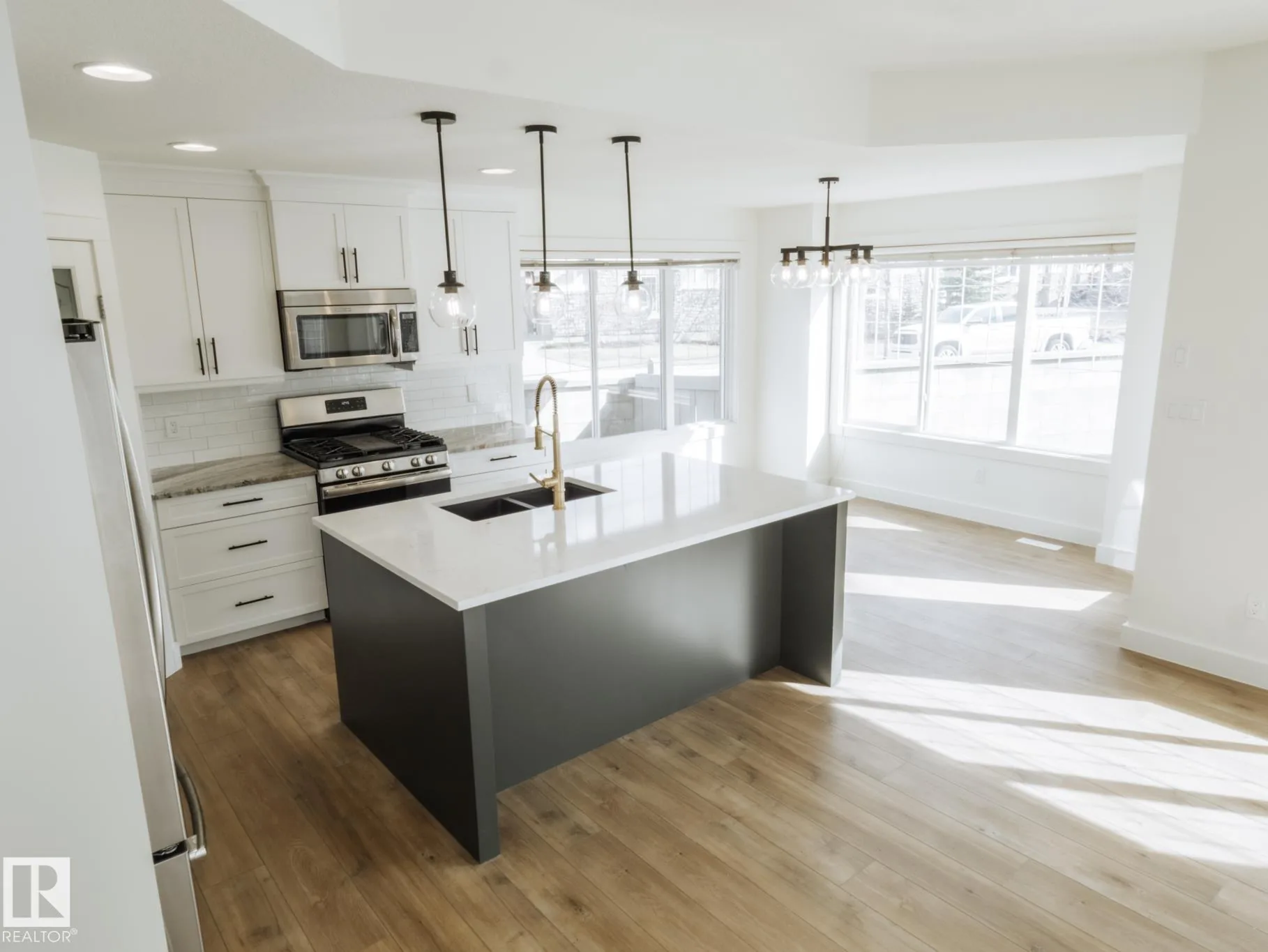 Range, island, and dining light fixtures in one frame