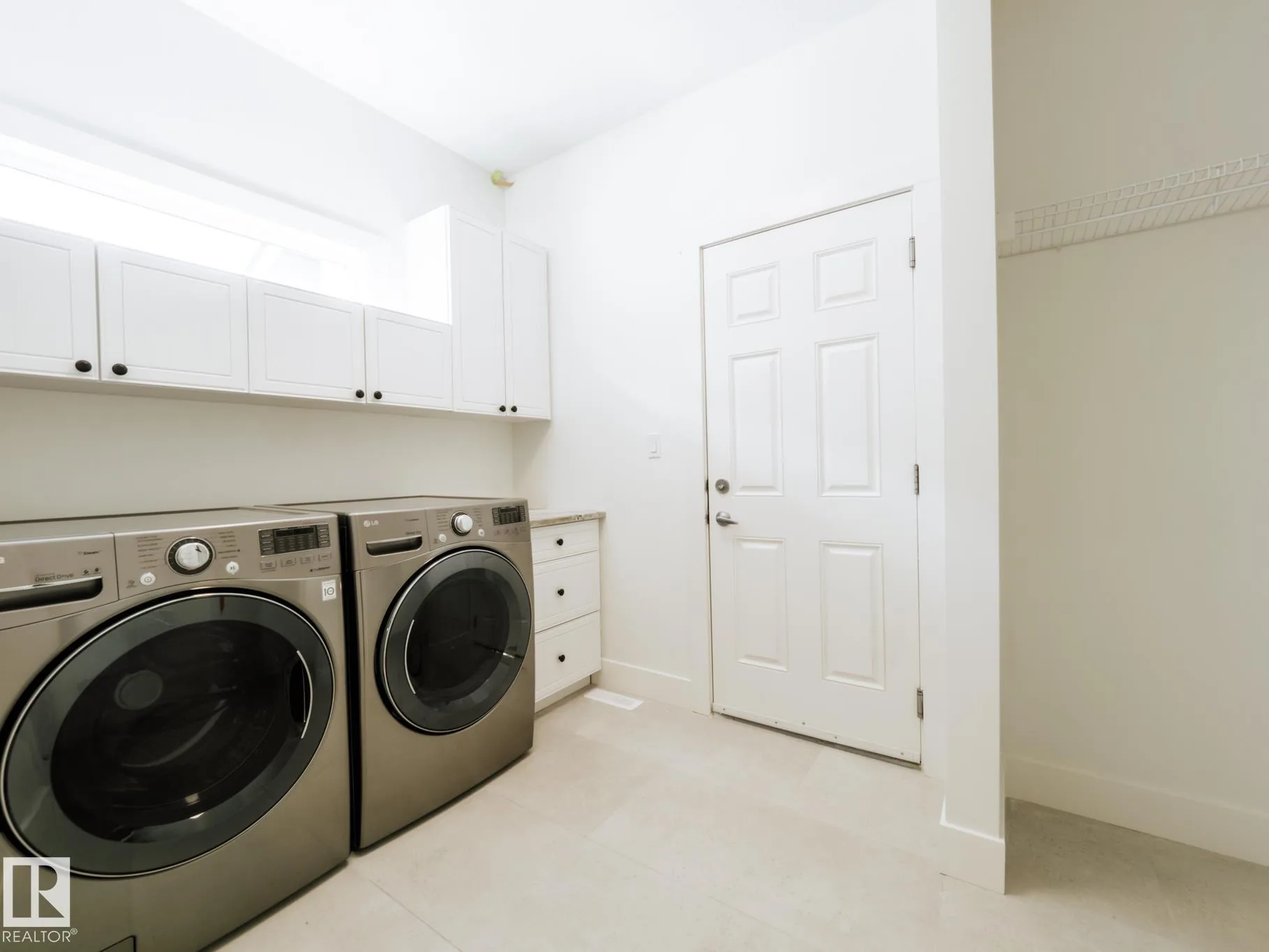 Laundry viewed toward the door leading out to the heated garage