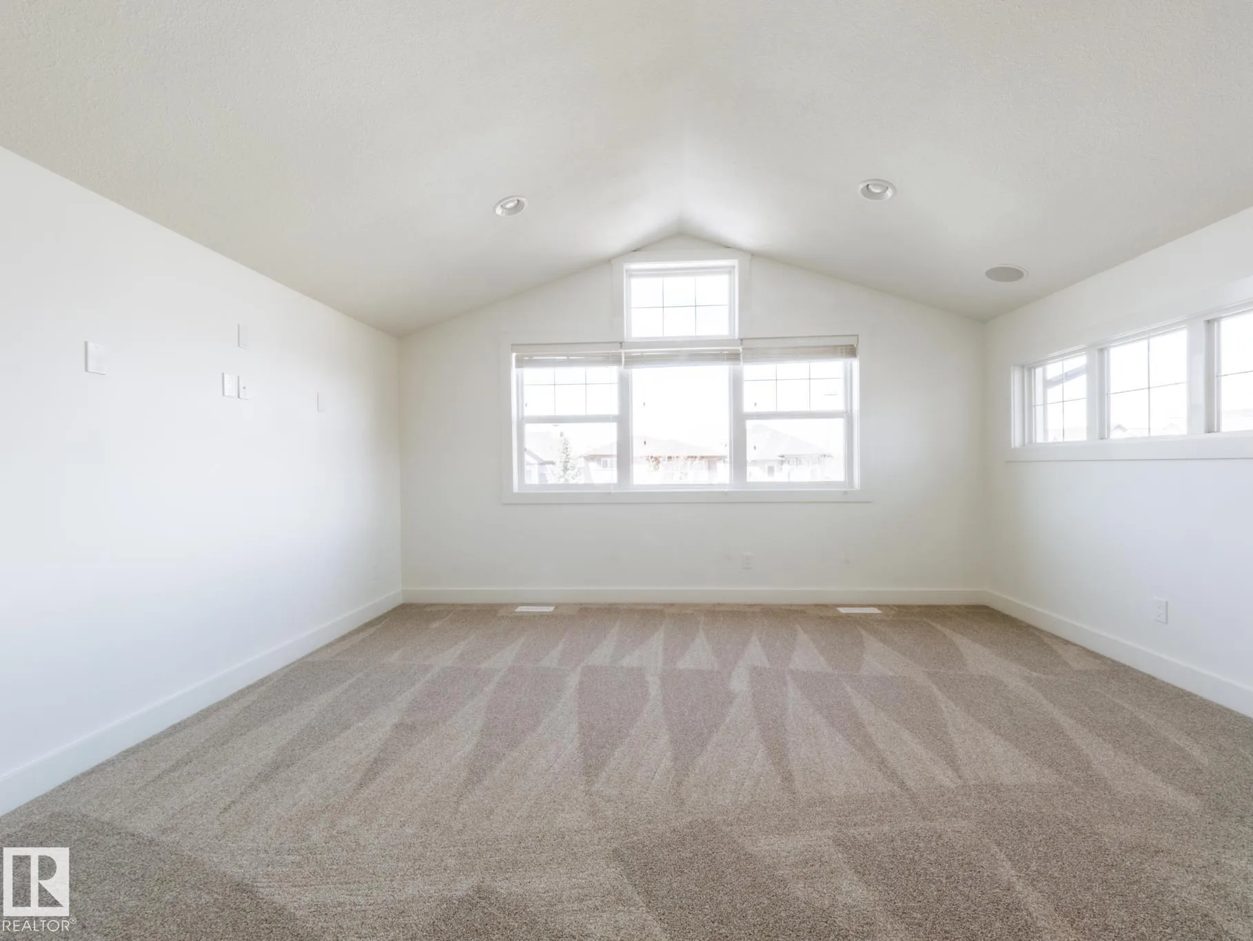 Bonus room from the opposite corner, door open to the hallway