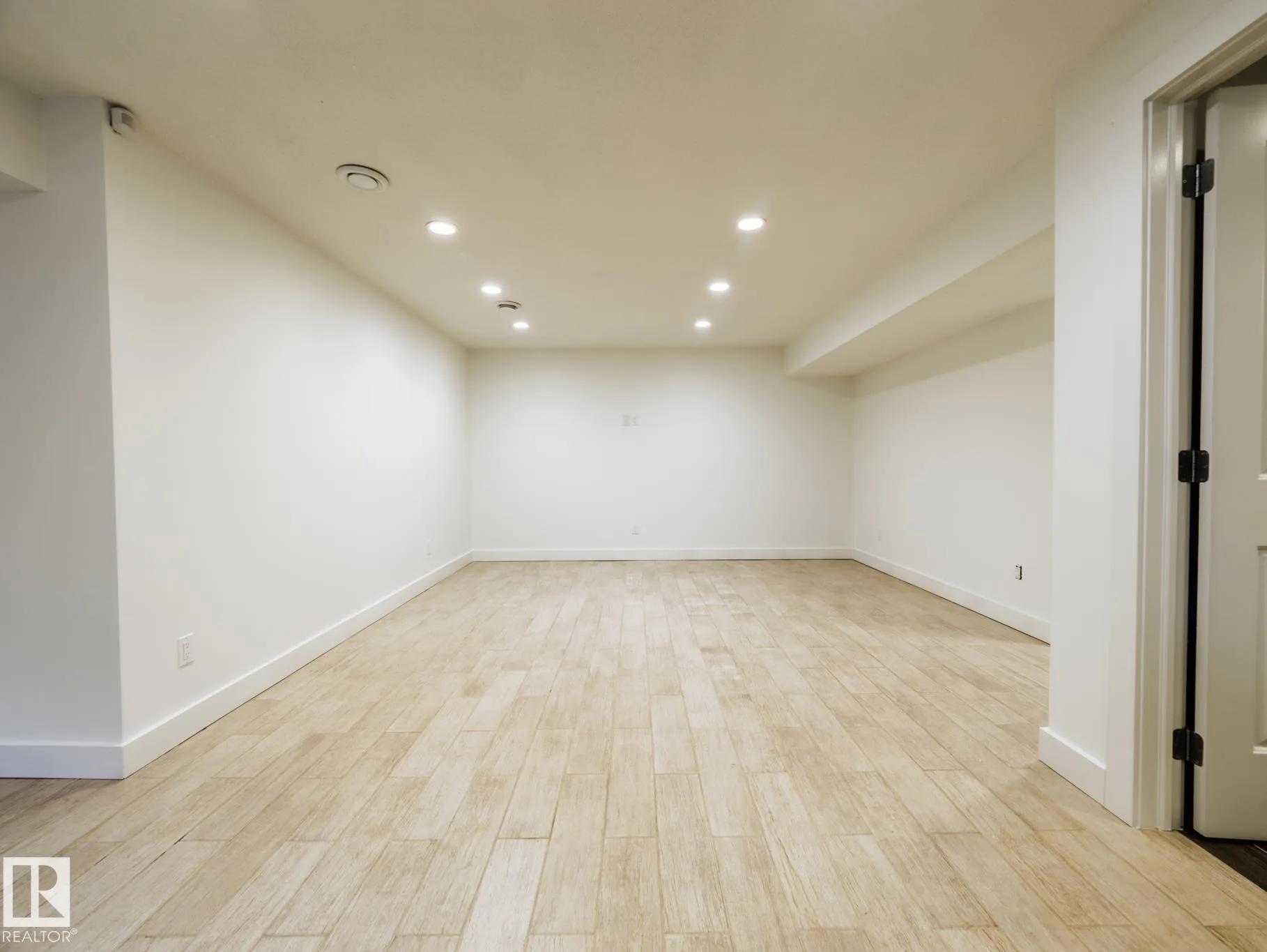 Basement family room from a third angle, open floor plan