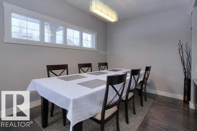 Before renovation, dining room with the original three-panel horizontal window bank
