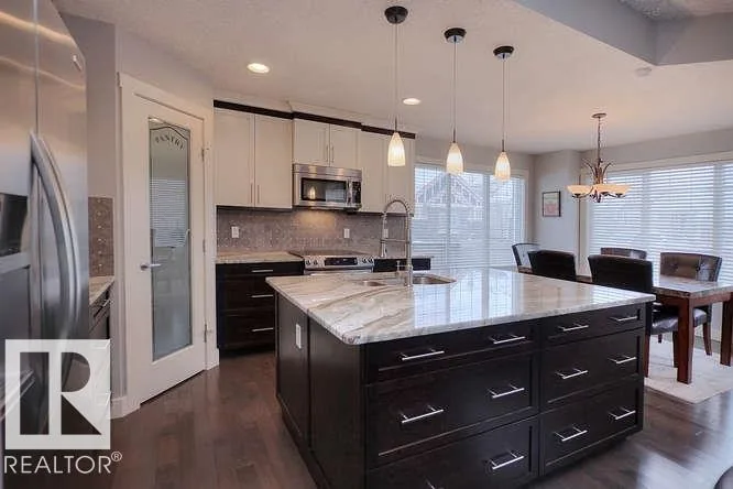 Before renovation, kitchen view toward the pantry and island