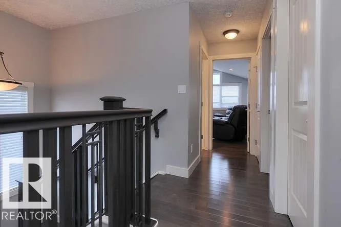 Before renovation, upper landing looking along the hallway to the bonus room