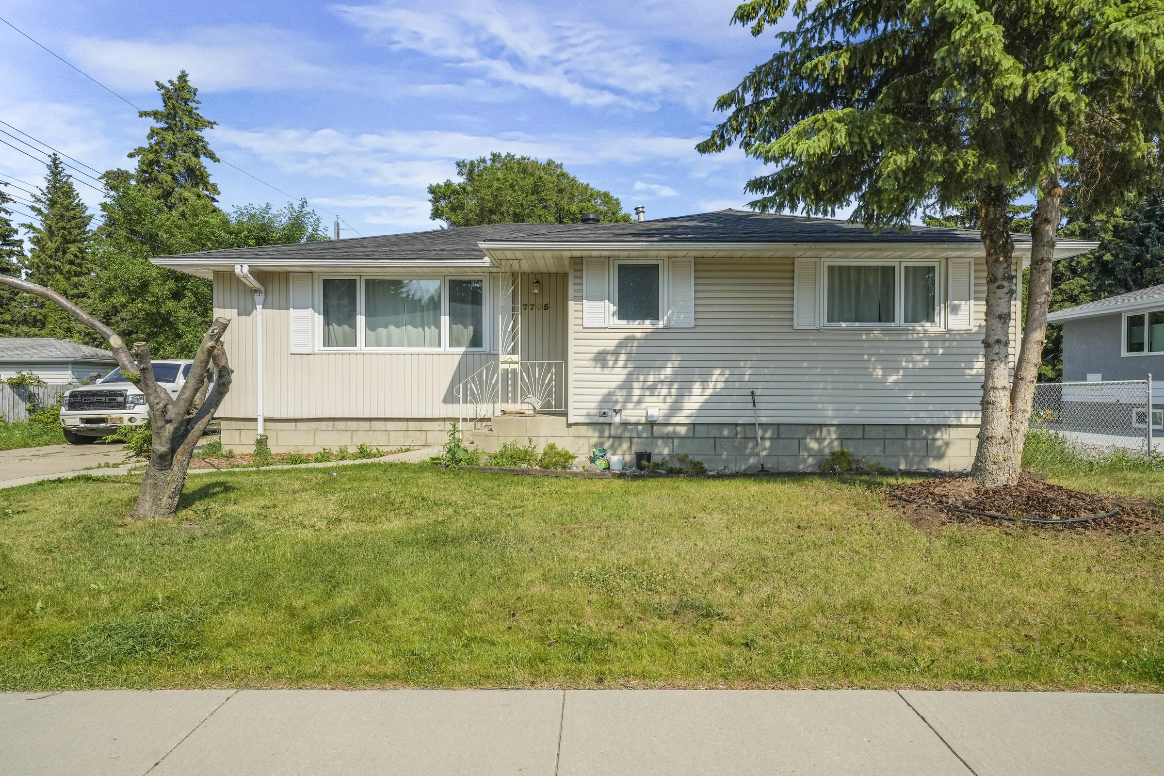 Front elevation, siding and roofline unchanged